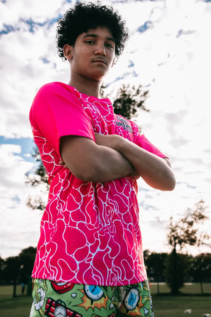 Untamed Gear athlete close-up in pink organic pattern rugby shirt